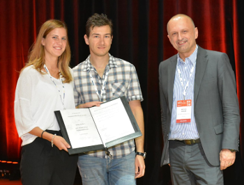 Urša in Gavrilo while receiving the best poster award